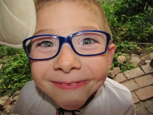 kid glasses smiling
